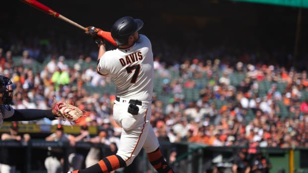 SD Giants third baseman J.D. Davis (7) hits a three run home run against the Cleveland Guardians at Oracle Park (2023).